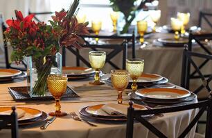 sophisticated table arrangements with yellow jackfruit glasses photo