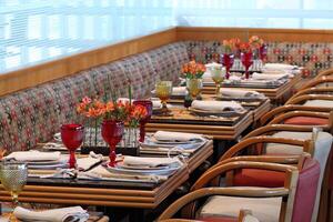 sophisticated table arrangements with red jackfruit glasses photo