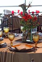 sophisticated table arrangements with yellow jackfruit glasses photo
