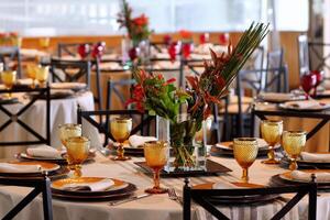 sophisticated table arrangements with yellow jackfruit glasses photo