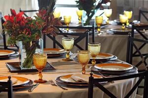 sophisticated table arrangements with yellow jackfruit glasses photo