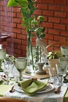creative and informal table set up outside the house with all the details photo