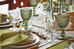 creative and informal table set up outside the house with all the details photo