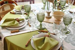 creative and informal table set up outside the house with all the details photo