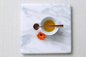 marble tray with bowl of olive oil photo