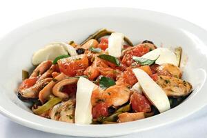 tagliatelle al mare with mussels, cheese and tomato sauce photo