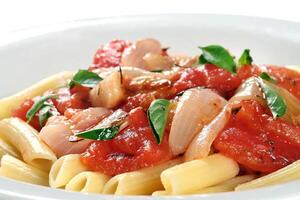 penne al pomodori, with tomatoes, mushrooms and basil photo