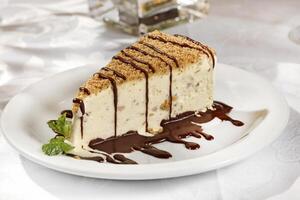 Almond cassata and chocolate sauce photo