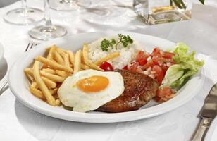 Horse sirloin, Brazilian dish with meat and egg photo