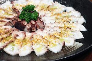 Octopus carpaccio with mustard and olive oil photo