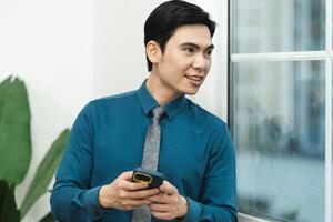 Image of Asian male businessman working in the office photo