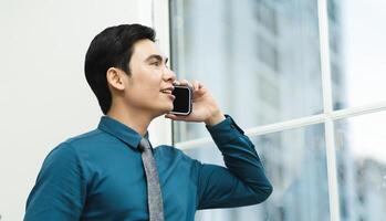 Image of Asian male businessman working in the office photo