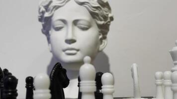 Strategy game Chess and ancient greek statue head video