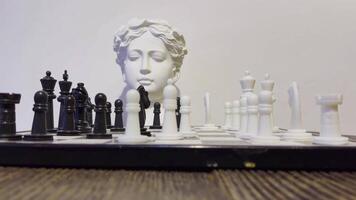 Strategy game Chess and ancient greek statue head video