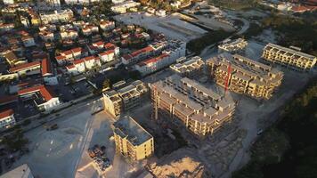 Panoramic perspective of significant construction site nestled within popular tourist destination overlooking ocean, featuring tower crane, situated in Punta Cana, Dominican Republic video