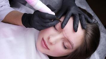 Application of pigment for permanent eyebrow makeup video