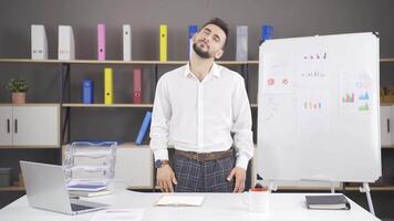 Businessman doing exercises to be done in the office. video