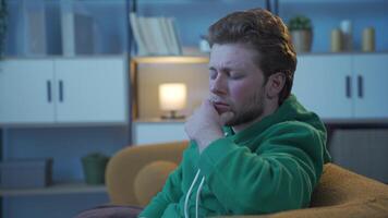 Sad young man thoughtful at night. video