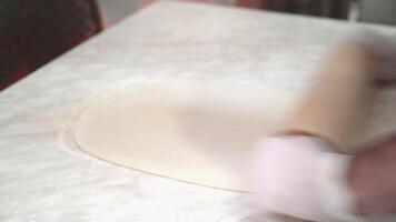 Pizza dough. Cook making delicious pizza at the restaurant, close-up video