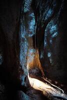 The contrast between light and darkness in the rock crevices. photo