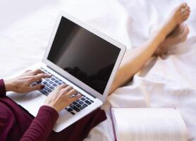 Home office. The young woman communicates comfortably in her home office with the help of technology and the Internet. photo