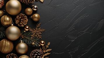 Christmas background with golden decorations on black. Top view with copy space photo