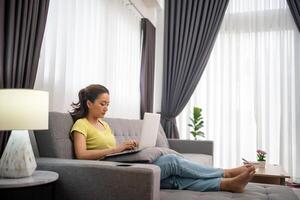 Woman working in the home , freelancing woman working concept photo