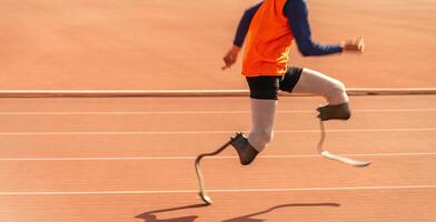 Asian para-athlete runner prosthetic leg on the track alone outside on a stadium track Paralympic running concept. photo