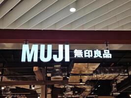 Bangkok, Thailand March 03, 2024 MUJI sign. It is is a famous Japanese retailer which sells a wide variety of household and consumer goods in Thailand. photo