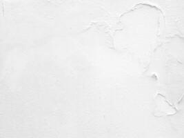 White grunge peeling concrete wall background. photo