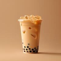 Bubble milk tea with tapioca pearls in plastic glass photo