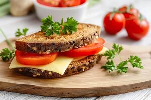 Detailed view of a delicious sandwich with cheese on a wooden cutting board. photo