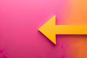 A yellow arrow pointing to the right against a pink background. photo