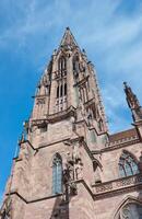 The church tower of Freiburg Minster on a sunny day, Germany photo