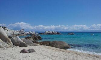 Turquoise Sea Water Meeting Seashore at Sithonia Peninsula photo