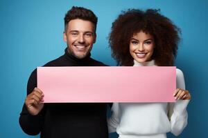 A boy and a girl hold a long pink paper in their hands on a blue background. photo