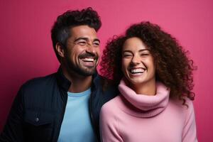 Portrait of a Hispanic boy and a Caucasian girl on a pink background. photo