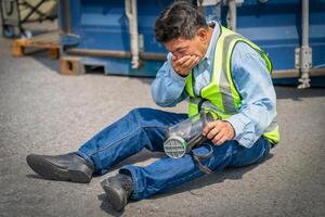 Engineer or foreman has an accident while working on Container ship. Logistics global import or export shipping industrial concept. photo