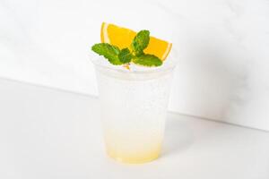 yuzu with soda in glass photo