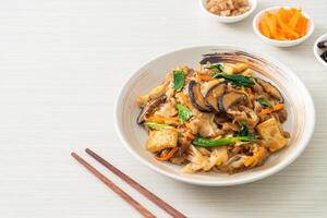 stir-fried noodles with tofu and vegetables photo