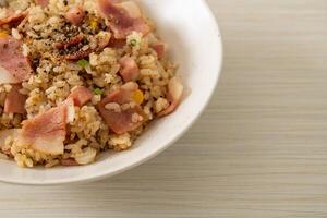 fried rice with bacon ham and black peppers photo