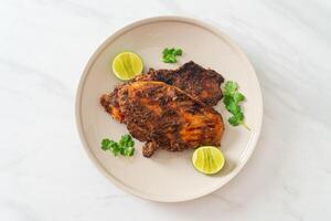 spicy grilled jamaican jerk chicken photo