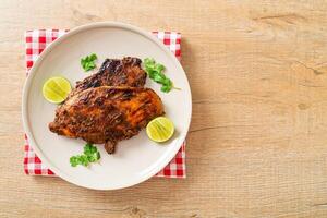 spicy grilled jamaican jerk chicken photo