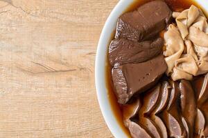 stewed duck offal in brown soup photo