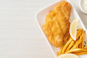 fish and chips - fried fish fillet with potatoes chips photo