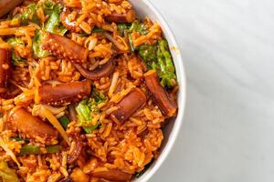 Stir-fried squid or octopus with Korean spicy sauce rice bowl photo