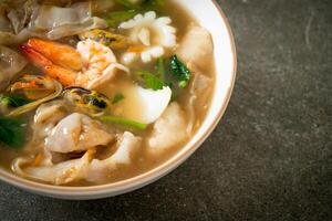 Wide Rice Noodles with Seafood in Gravy Sauce photo