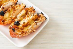 grilled river prawns or shrimps with cheese photo