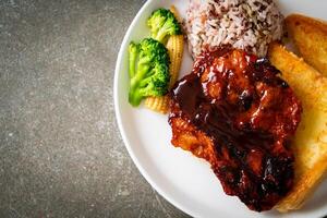 barbecue pork steak with rice berry photo