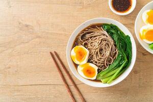 ramen noodles with egg - vegan or vegetarian food style photo